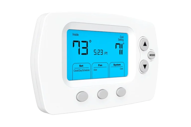 A Digital Thermostat Displaying An Indoor Temperature Of 73°F And A Cool Setting Of 71°F. The Screen Shows The Time As 5:23 Pm With Buttons For Mode, Fan, And System Settings.